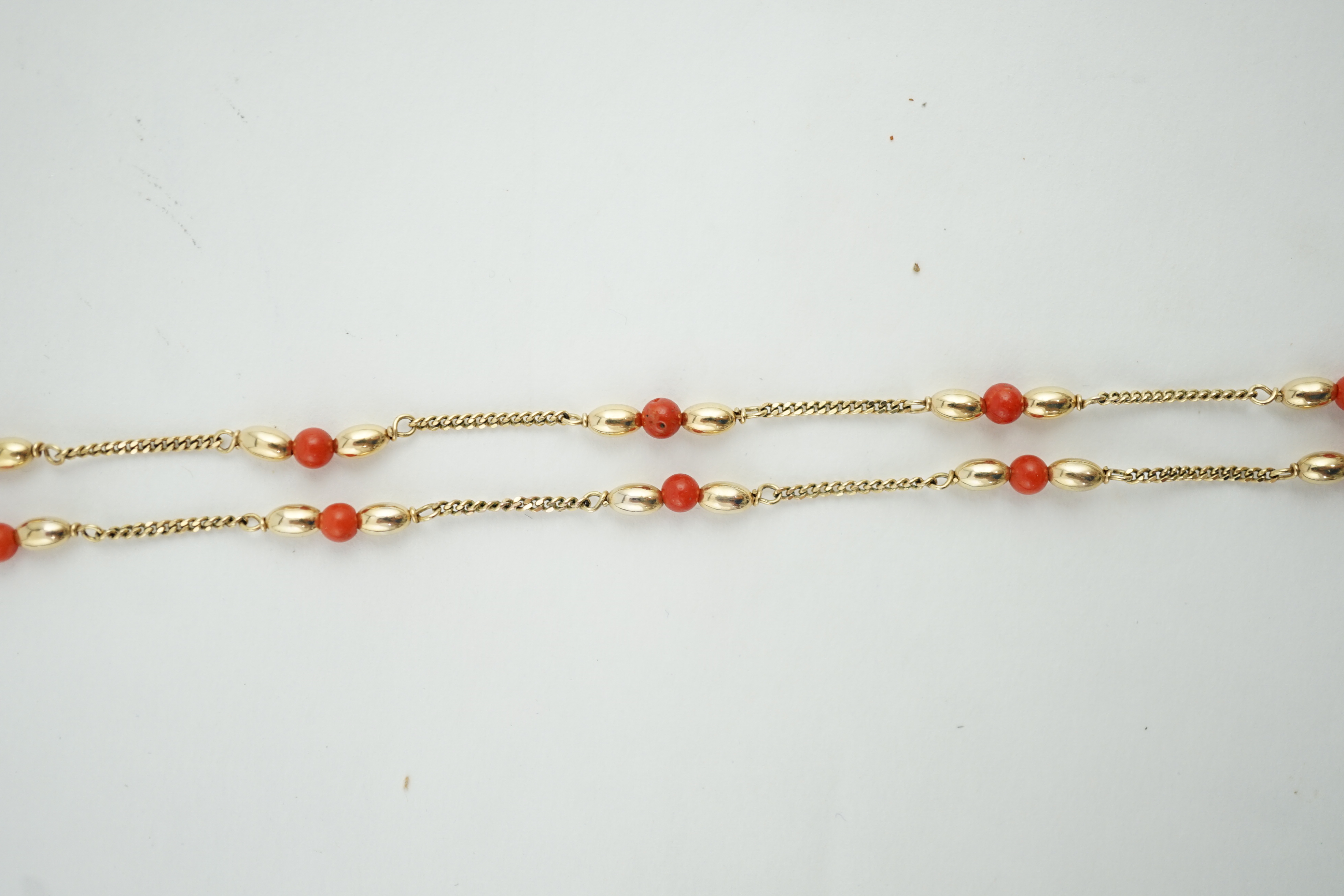 A modern 9ct gold and coral bead chain necklace